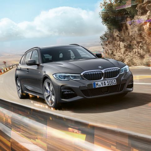 Imagine cu trei sferturi din designul părţii frontale a BMW Seria 3 Touring Imagine cu trei sferturi din partea frontală a BMW Seria 3 Touring, rulând peste un pod, într-un mediu rural