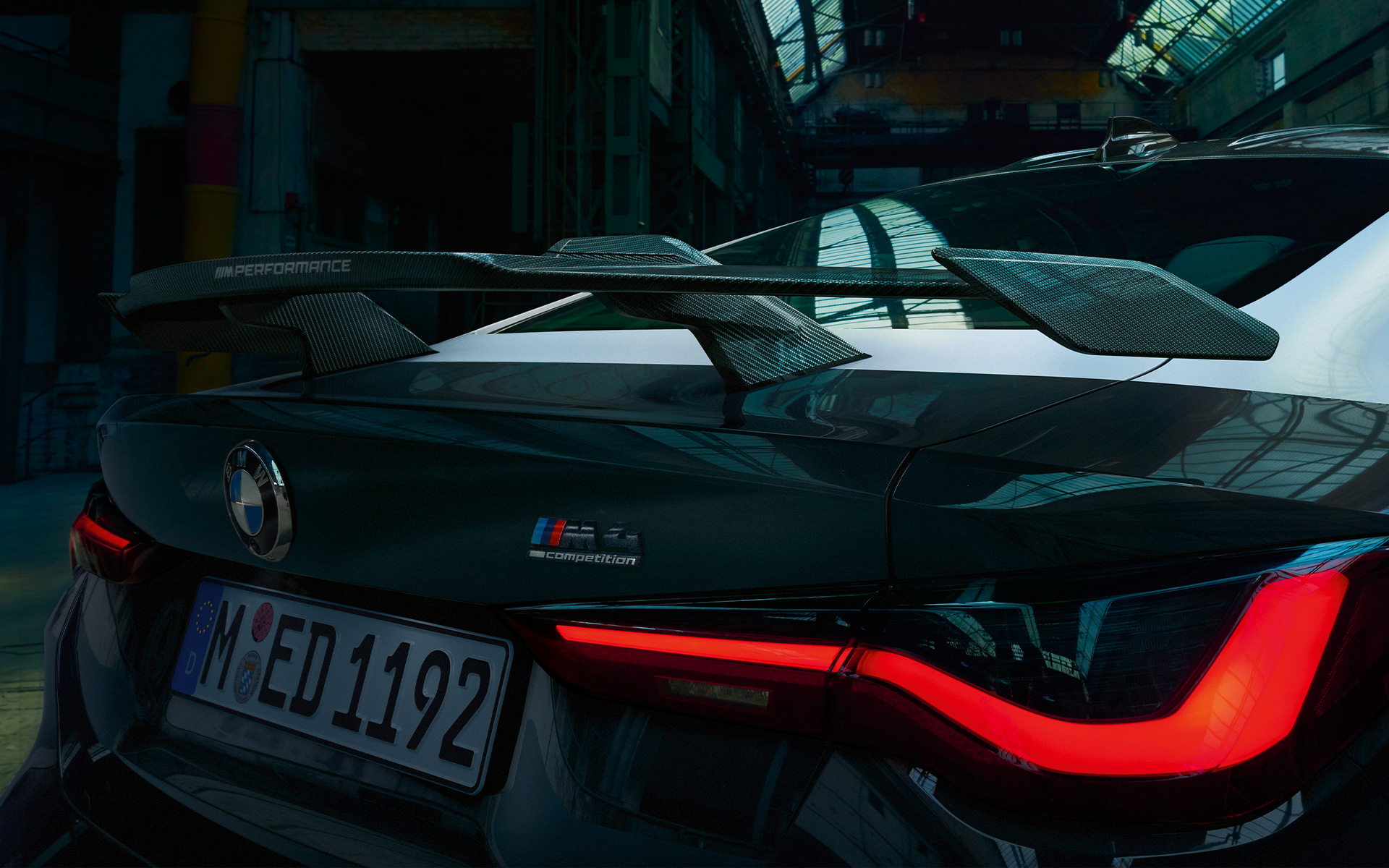 Imagine în prim plan din spate cu BMW M4 G82 Imagine în prim plan din spate cu BMW M4 G82, cu accesorii BMW M Performance